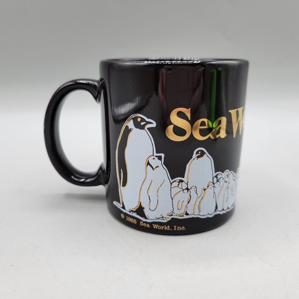 Vintage 1991 Sea World Black Ceramic Mug With Gold Logo Penguin Whale Graphics